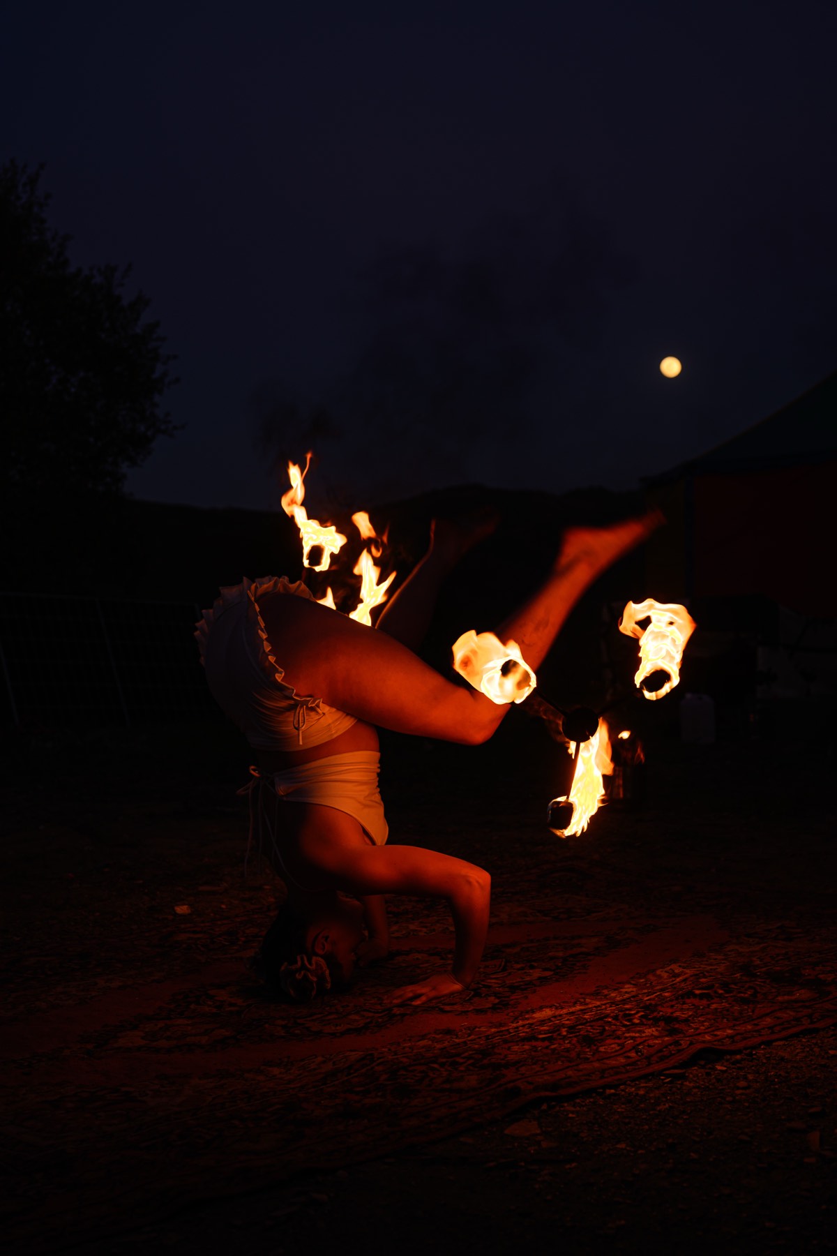 Fire poi on the rug after dark.