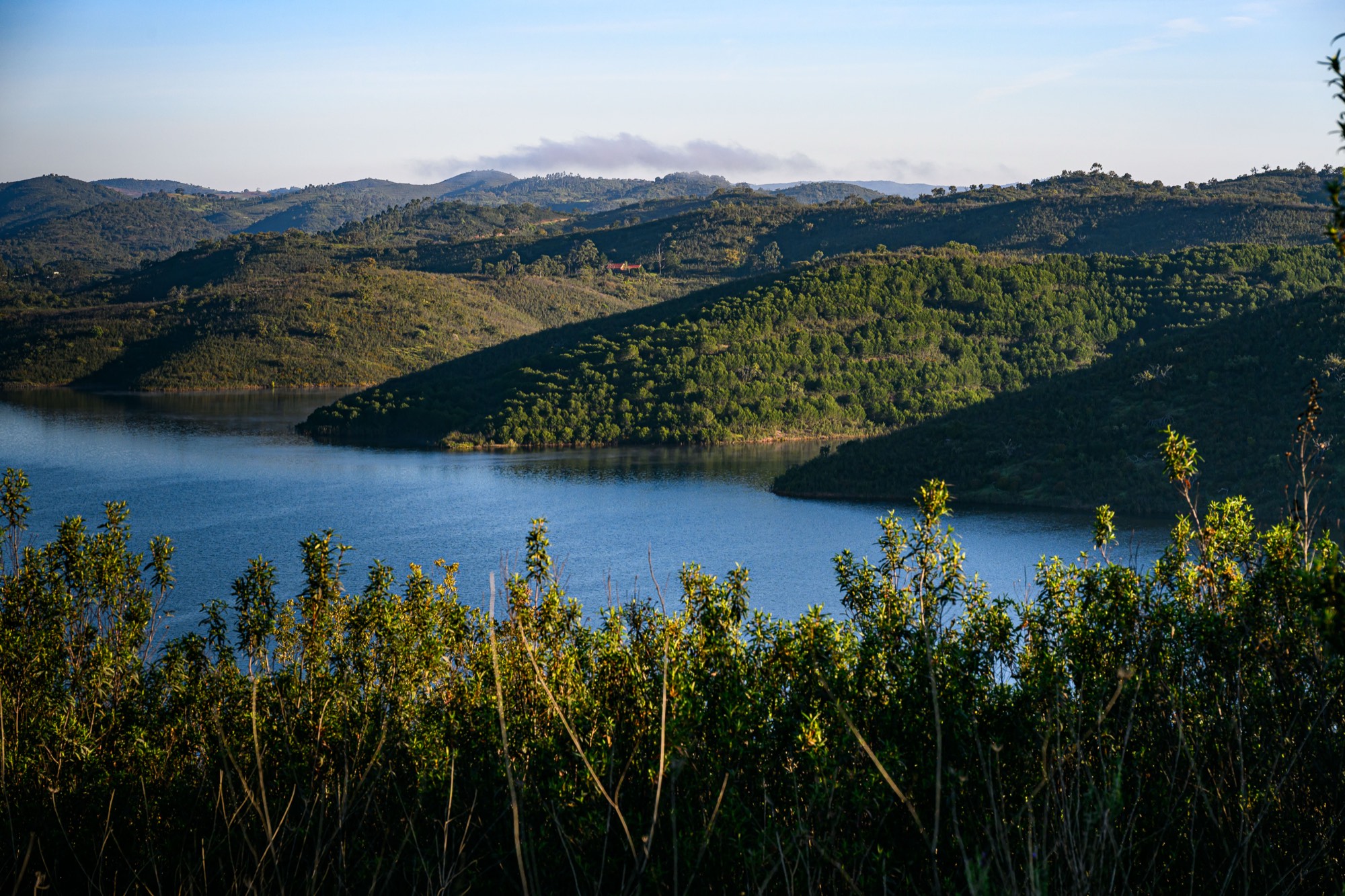 The lake between the wooded hills.