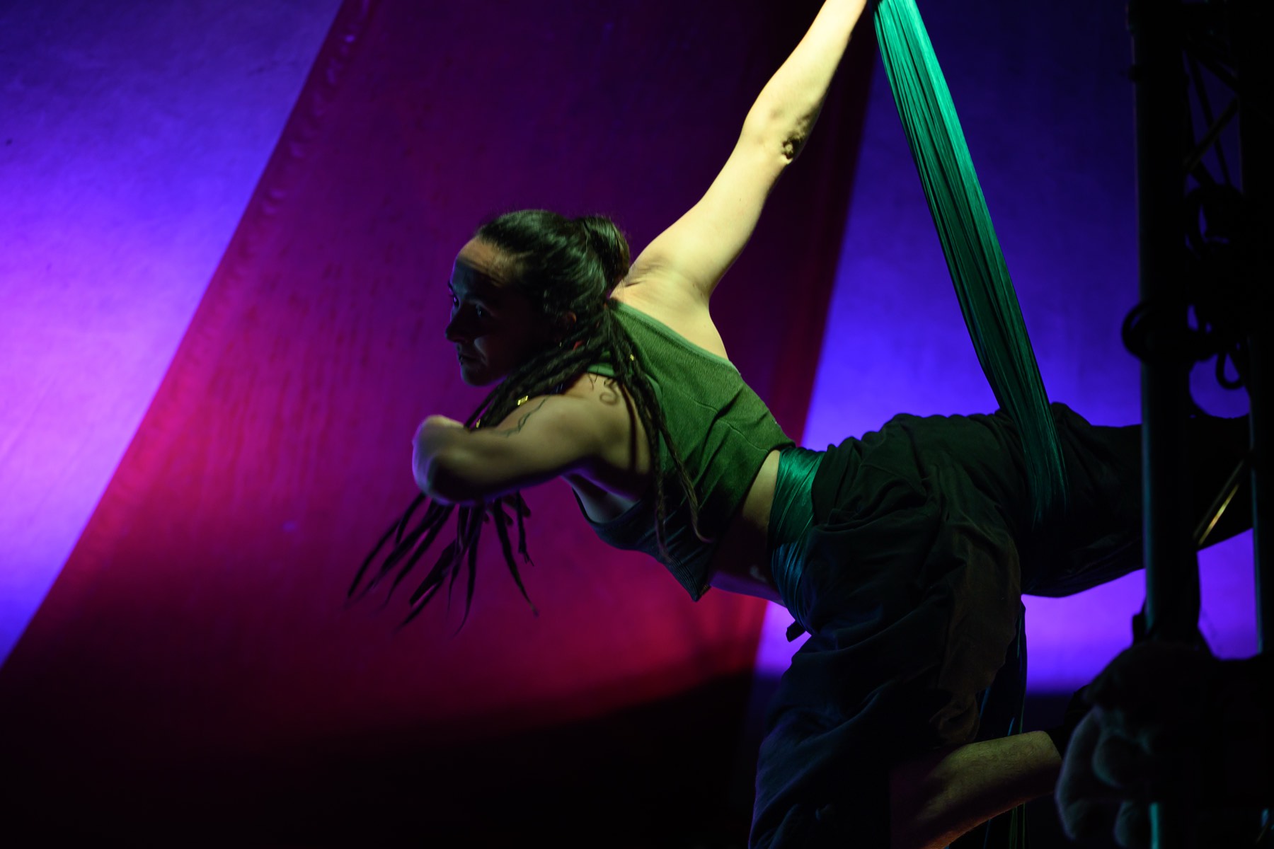 Aerial silks under the night lights.